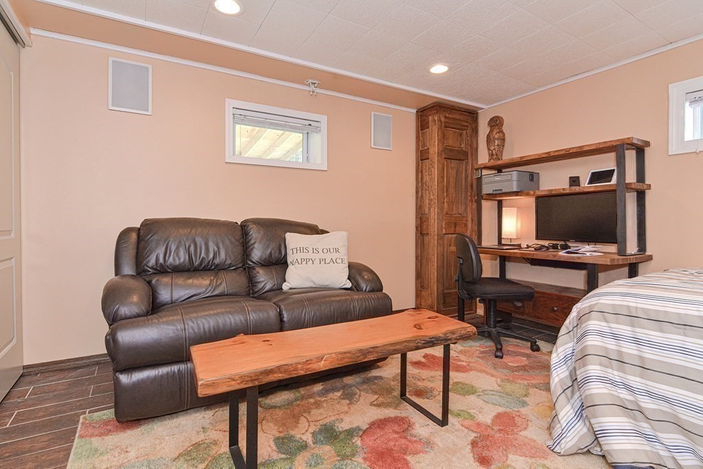 21 Coolidge Street Sherborn, MA 01770 - Photo 23 of 41 a living room with furniture and a flat screen tv
