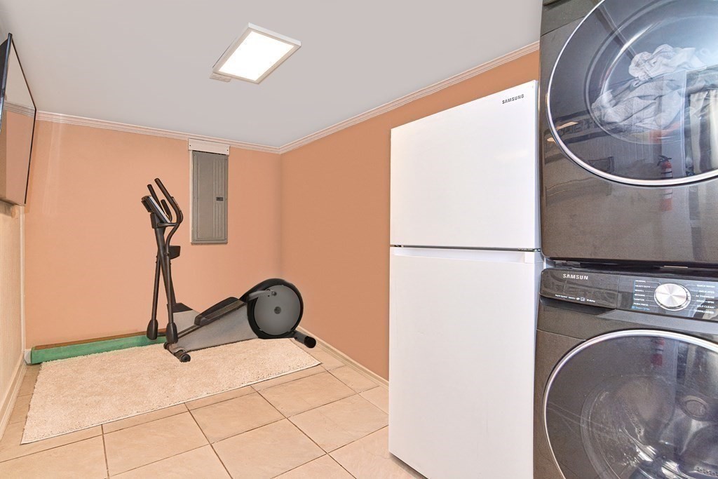 21 Coolidge Street Sherborn, MA 01770 - Photo 24 of 41 a view of a storage & utility room with washer and dryer