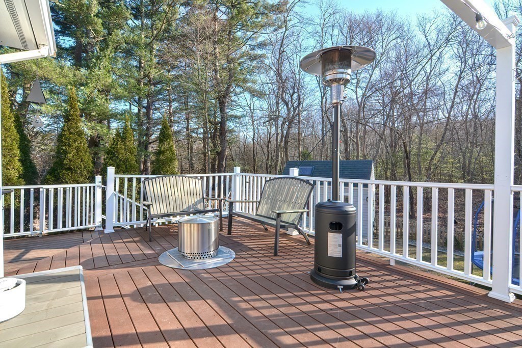 21 Coolidge Street Sherborn, MA 01770 - Photo 26 of 41 a view of a deck with wooden floor and outdoor seating