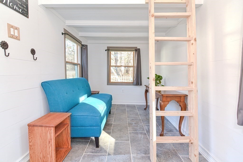 21 Coolidge Street Sherborn, MA 01770 - Photo 29 of 41 a living room with furniture and a window