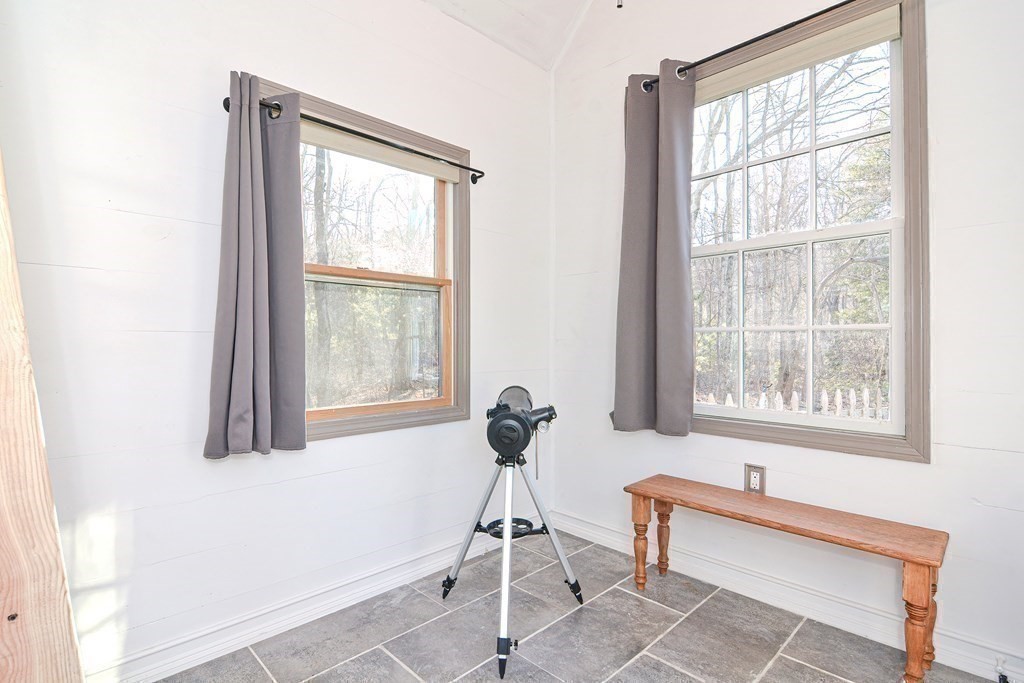 21 Coolidge Street Sherborn, MA 01770 - Photo 30 of 41 a room with gym equipment and windows
