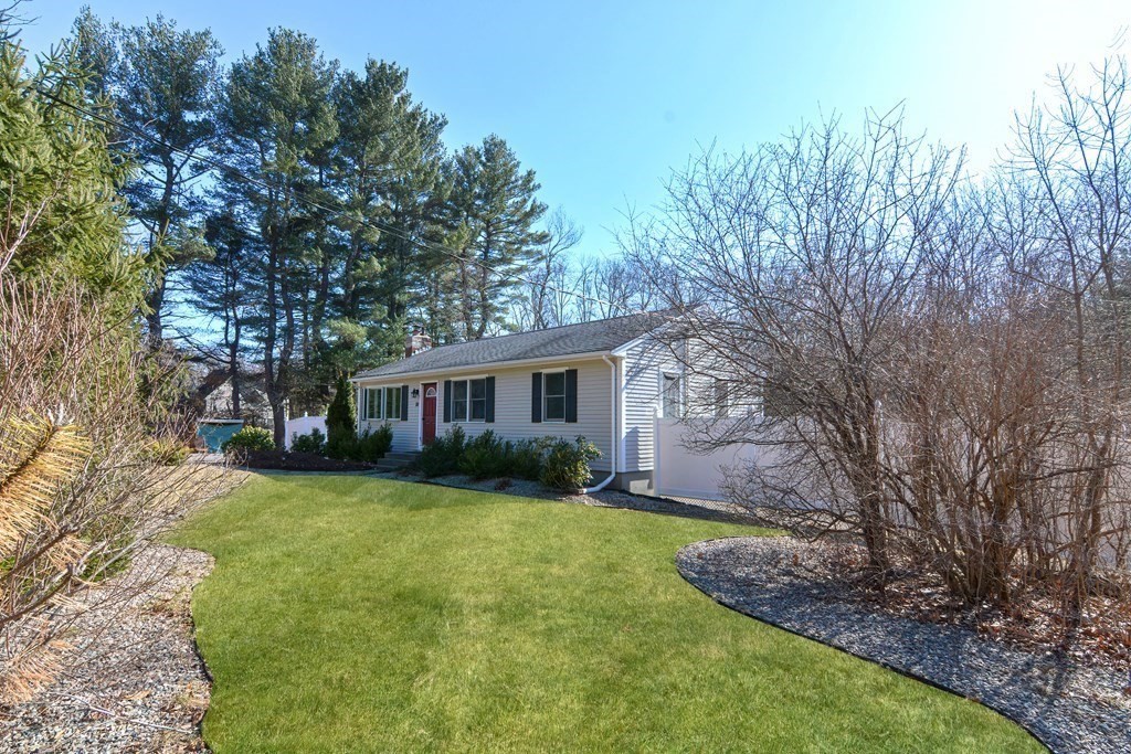 21 Coolidge Street Sherborn, MA 01770 - Photo 3 of 41 a view of a yard in front of a house with large trees