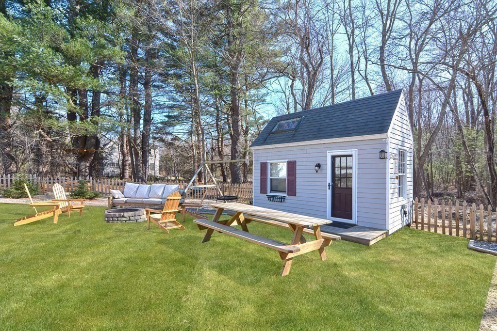 21 Coolidge Street Sherborn, MA 01770 - Photo 31 of 41 a view of a house with a yard and sitting area