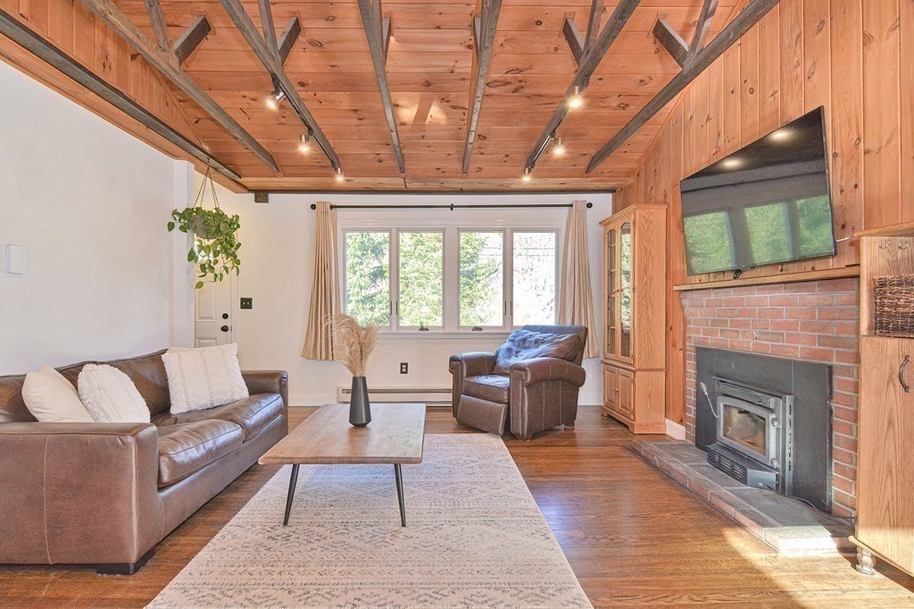 21 Coolidge Street Sherborn, MA 01770 - Photo 8 of 41 a living room with furniture and a fireplace