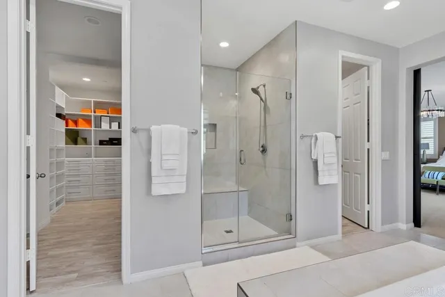 a bathroom with a shower and a sink