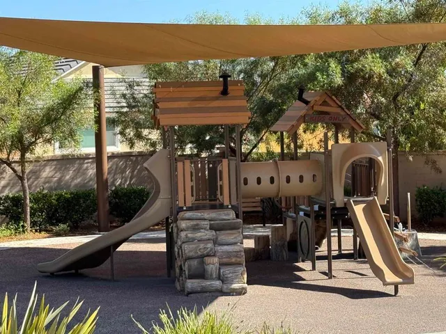 a view of a swimming pool with a patio and a yard