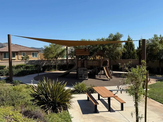 a view of a swimming pool and lounge chairs