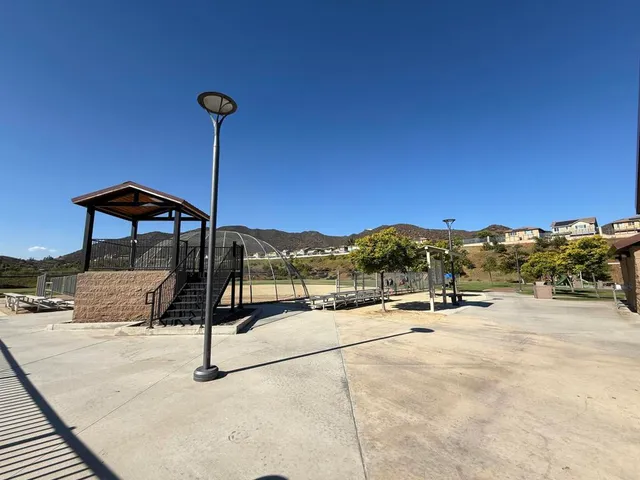 a view of a terrace with a wooden fence