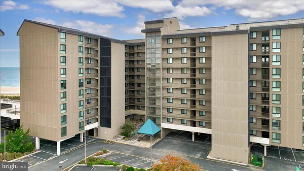 a front view of a building with glass windows