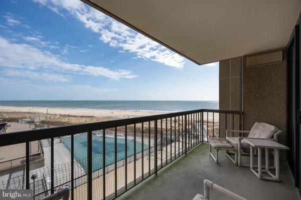 a view of a swimming pool with an ocean view