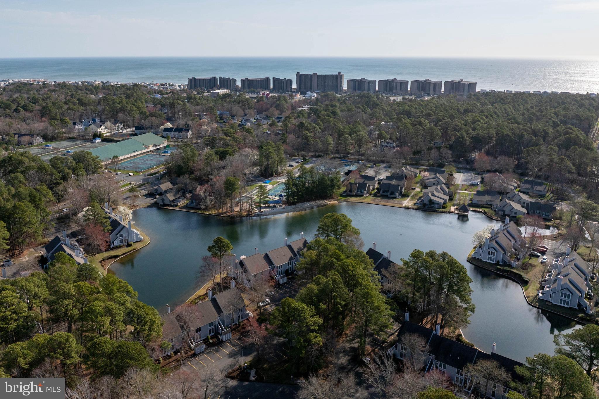 409 Georgetowne House Road Bethany Beach, DE 19930 - Photo 27 of 37 an aerial view of a city with lots of residential buildings ocean and mountain view in back