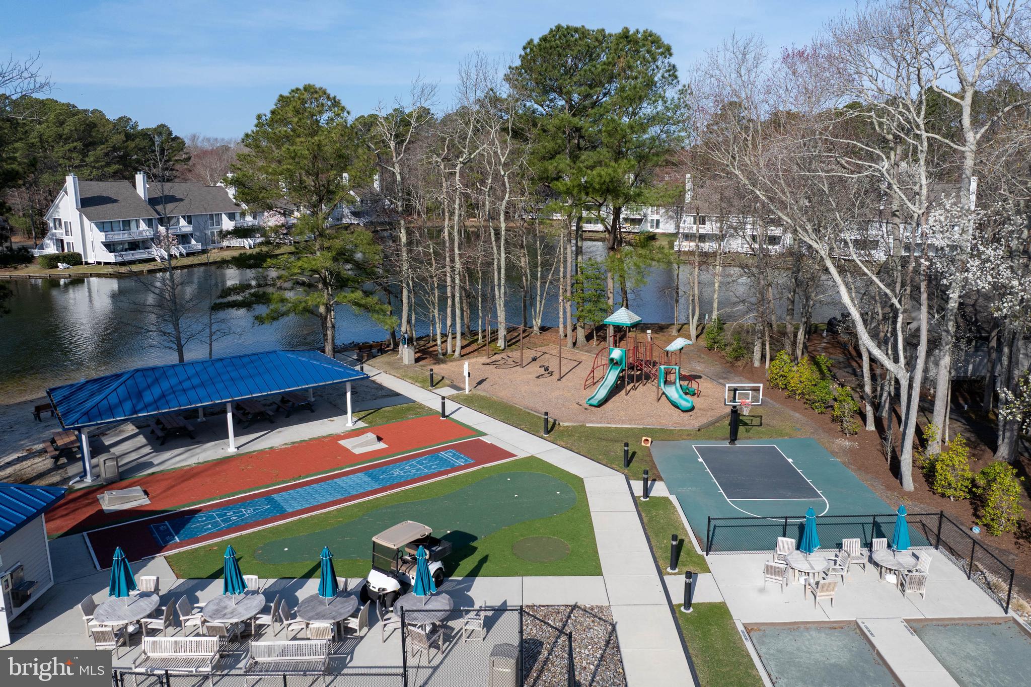 409 Georgetowne House Road Bethany Beach, DE 19930 - Photo 29 of 37 a view of swimming pool with outdoor seating