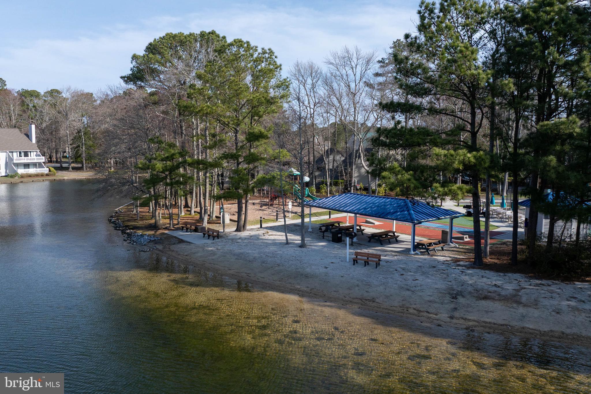 409 Georgetowne House Road Bethany Beach, DE 19930 - Photo 30 of 37 a view of a park with large trees