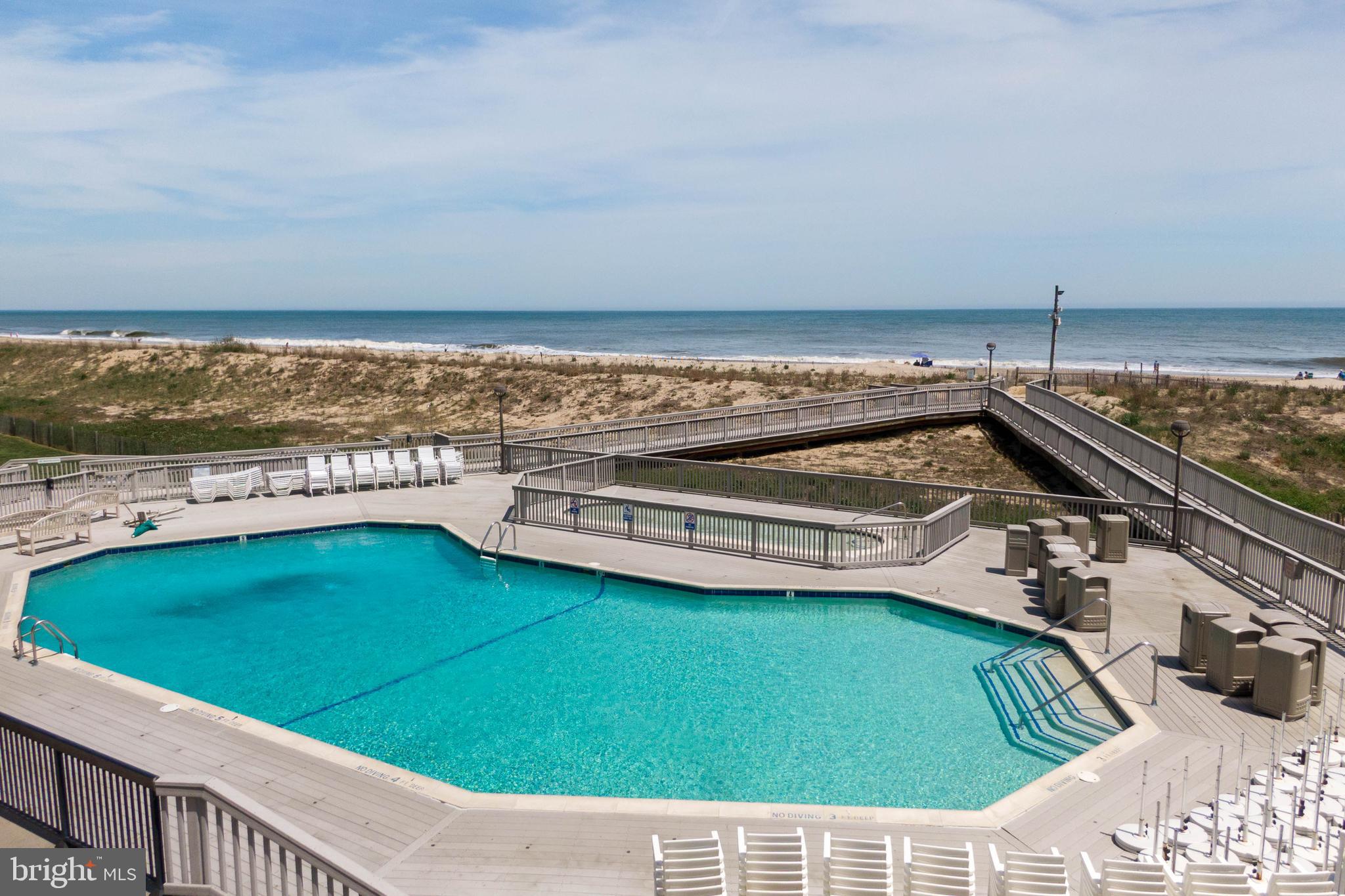 409 Georgetowne House Road Bethany Beach, DE 19930 - Photo 4 of 37 a view of a swimming pool with an ocean view