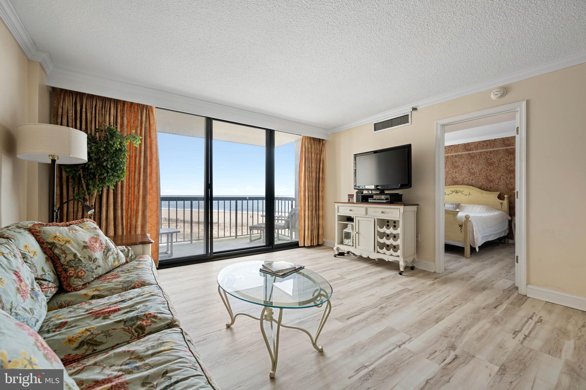 409 Georgetowne House Road Bethany Beach, DE 19930 - Photo 5 of 37 a living room with furniture and a flat screen tv