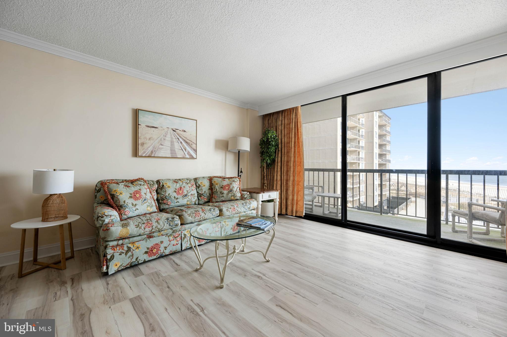 409 Georgetowne House Road Bethany Beach, DE 19930 - Photo 6 of 37 a living room with furniture and a large window