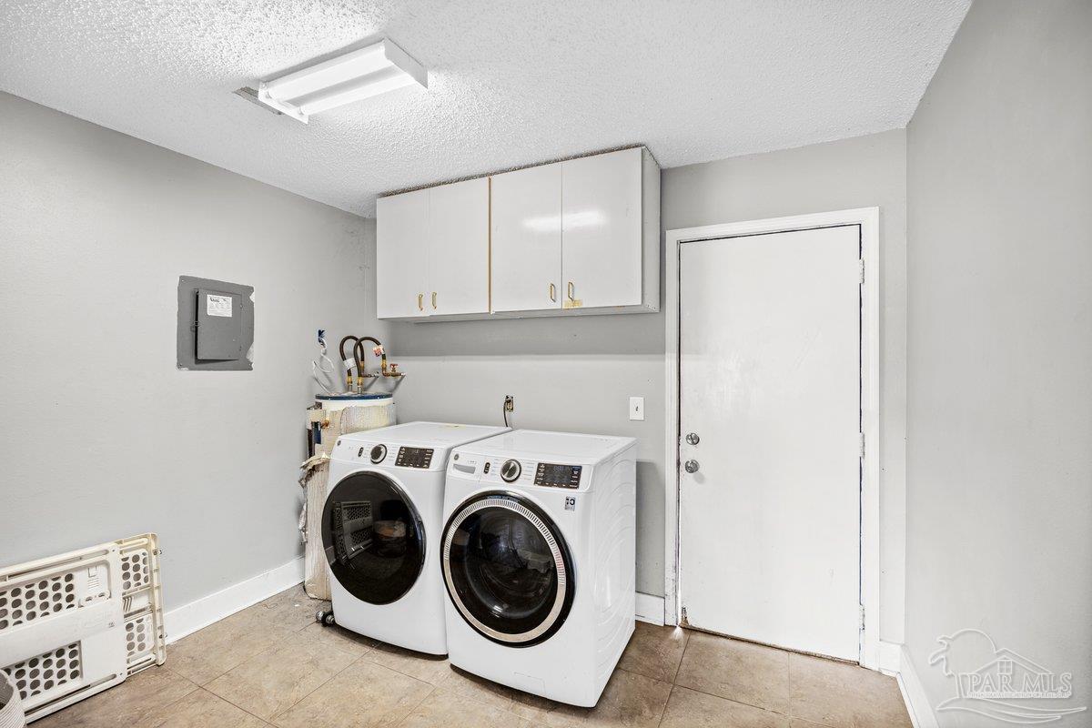 2194 Pompano Street Cantonment, FL 32533 - Photo 3 of 23 a utility room with dryer and washer