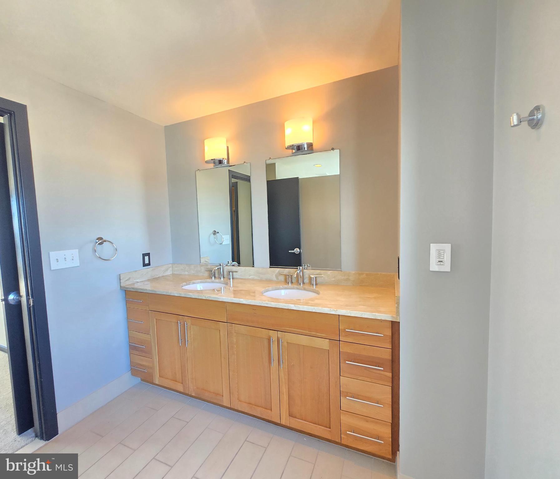 1200 Steuart Street, Unit 1913 Baltimore, MD 21230 - Photo 25 of 57 Sleek owner’s bathroom entrance.