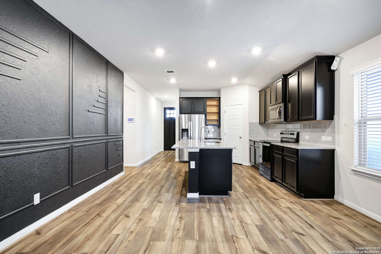 3168 Junction Bay Converse, TX 78109 - Photo 5 of 26 a kitchen with stainless steel appliances granite countertop a refrigerator stove top oven and sink