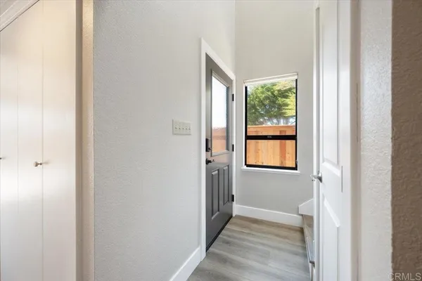 a view of a hallway with a window