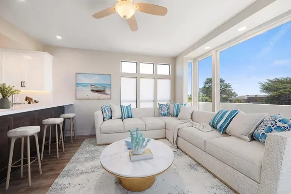 a living room with furniture and a large window