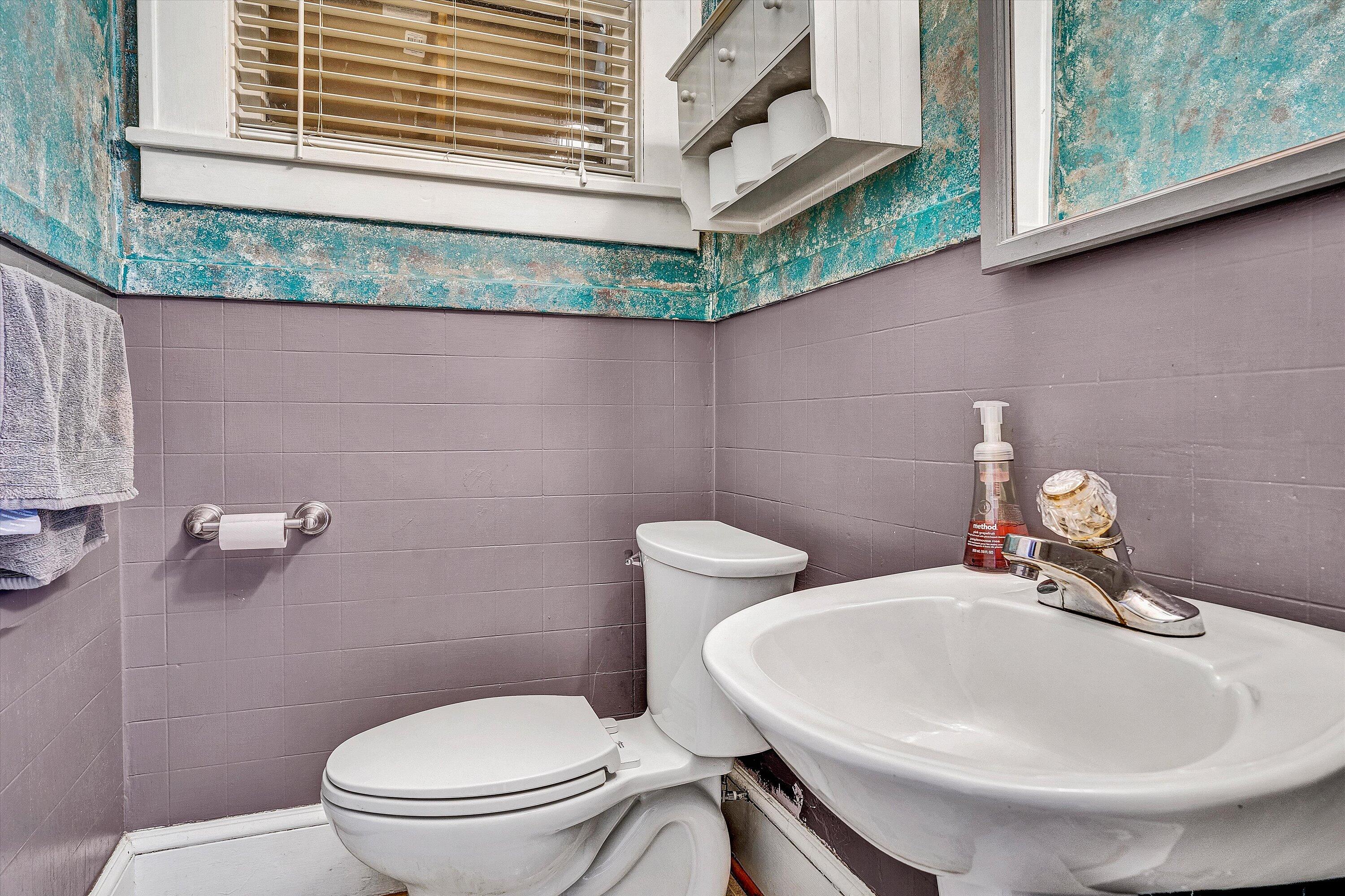 1013 Howbert Avenue Southwest Roanoke, VA 24015 - Photo 15 of 52 a bathroom with a toilet and a sink