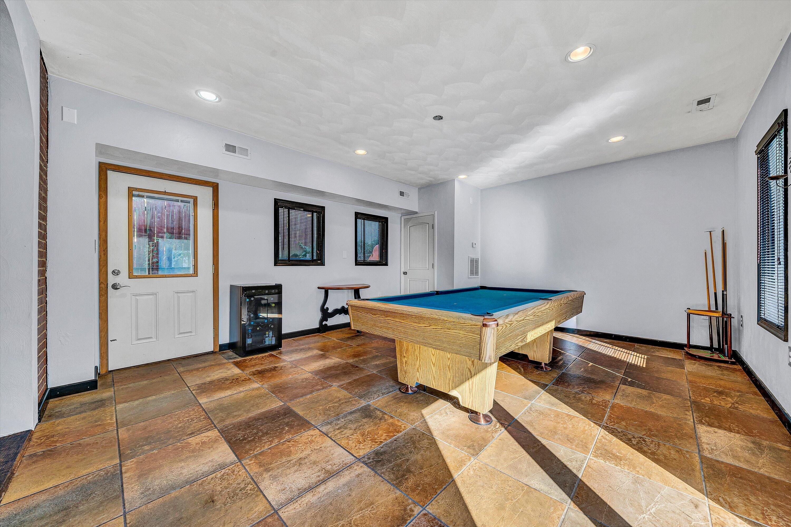 1013 Howbert Avenue Southwest Roanoke, VA 24015 - Photo 18 of 52 a living room with a table and a pool table