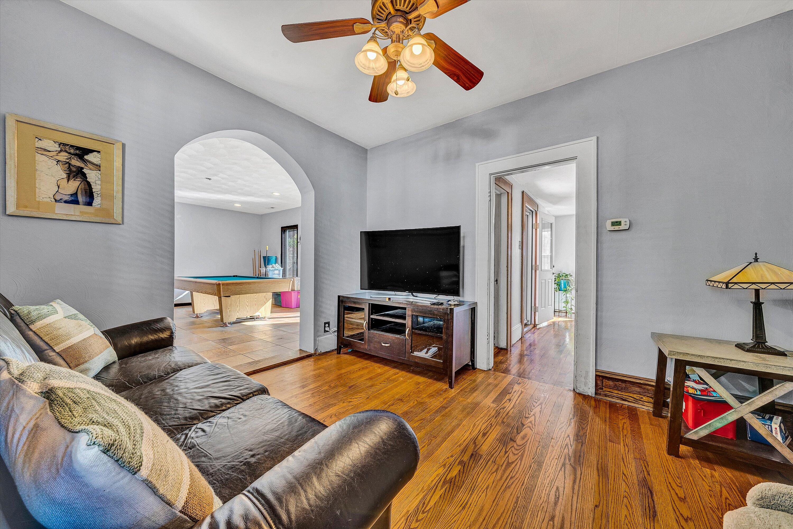 1013 Howbert Avenue Southwest Roanoke, VA 24015 - Photo 20 of 52 a living room with furniture and a flat screen tv