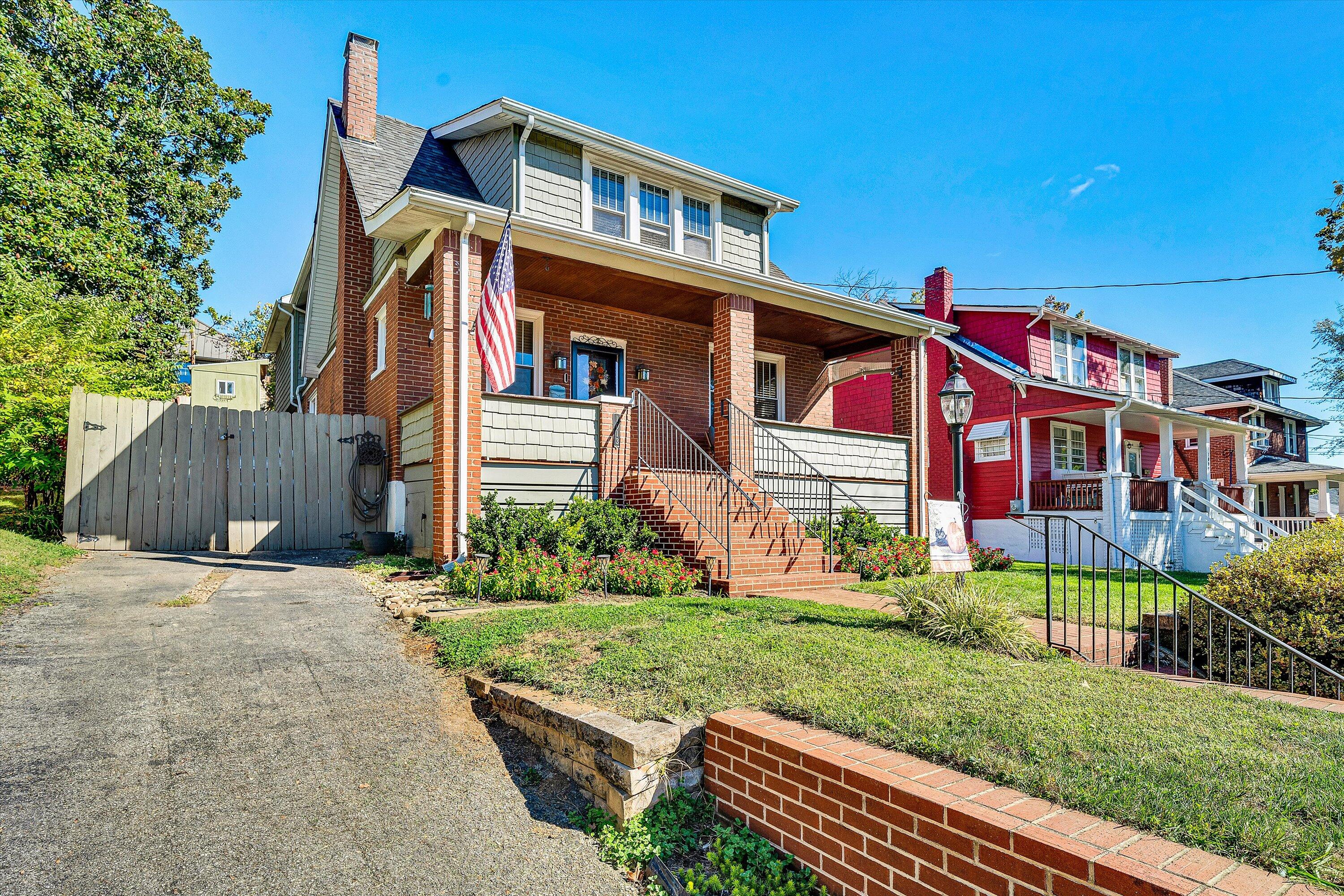 1013 Howbert Avenue Southwest Roanoke, VA 24015 - Photo 2 of 52 a front view of a house with a yard