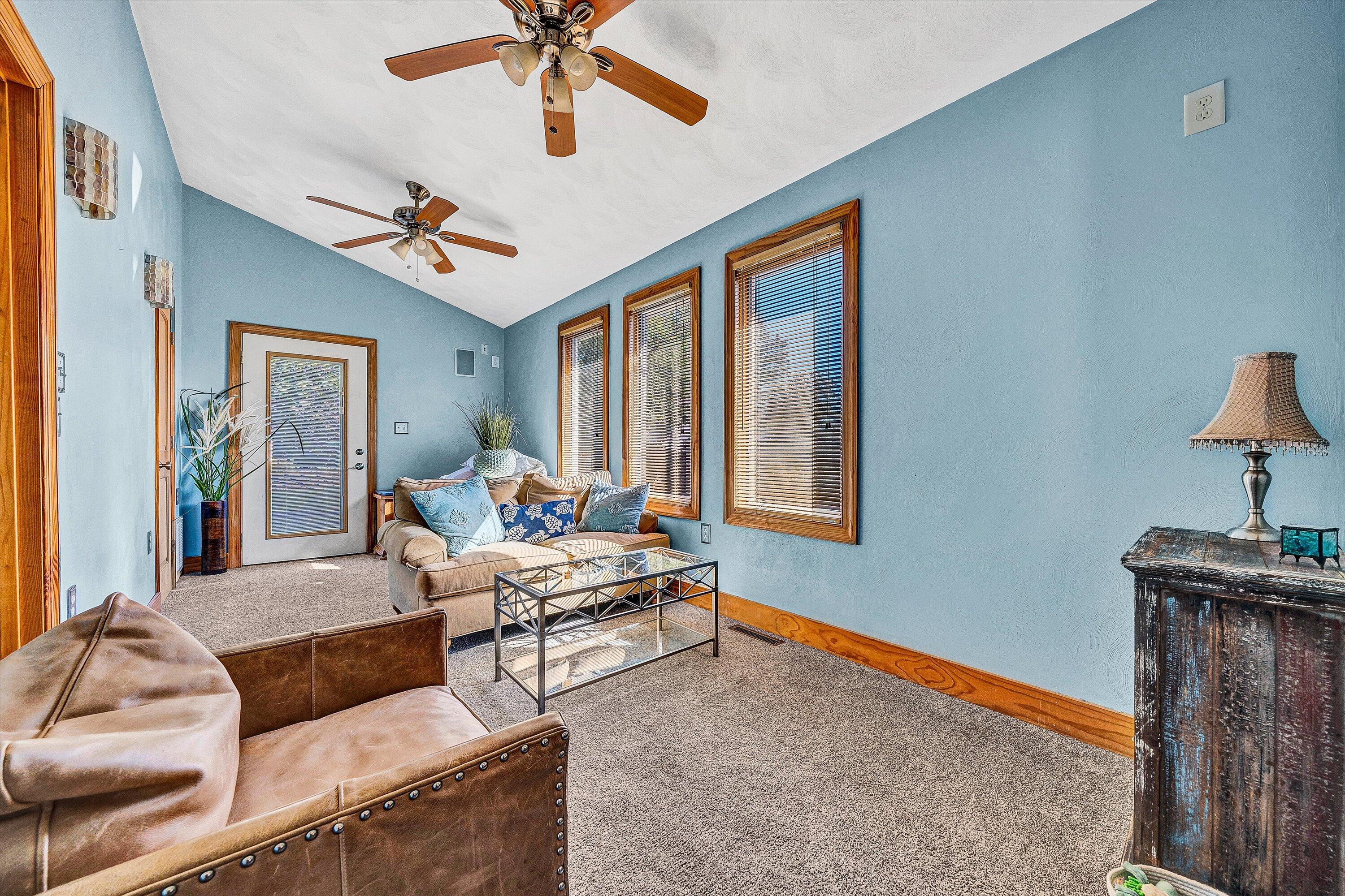 1013 Howbert Avenue Southwest Roanoke, VA 24015 - Photo 39 of 52 a living room with furniture ceiling fan and a window