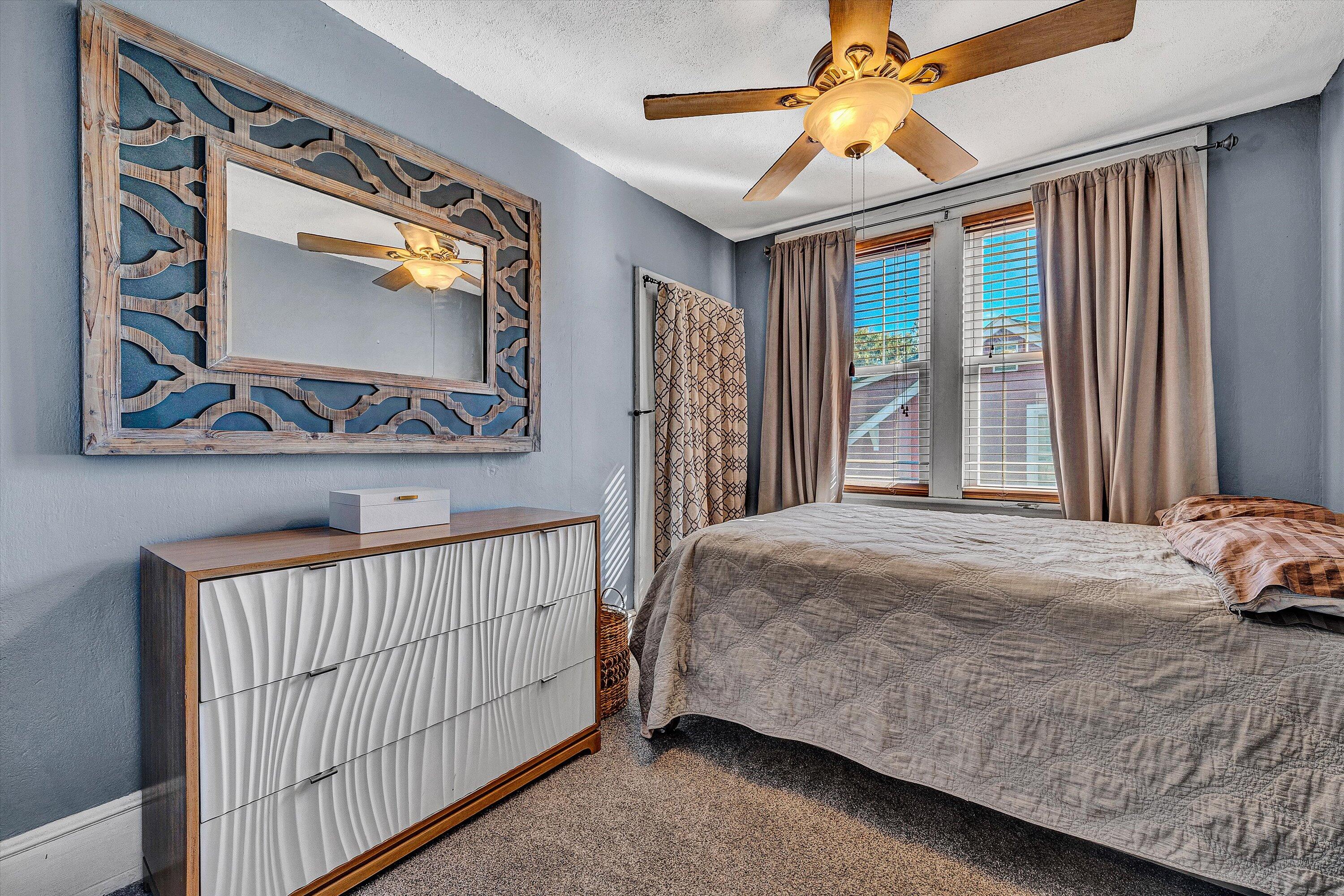 1013 Howbert Avenue Southwest Roanoke, VA 24015 - Photo 43 of 52 a bedroom with a bed and a chandelier