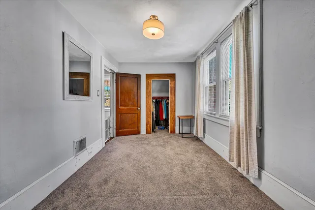 a view of empty room with floor to ceiling window