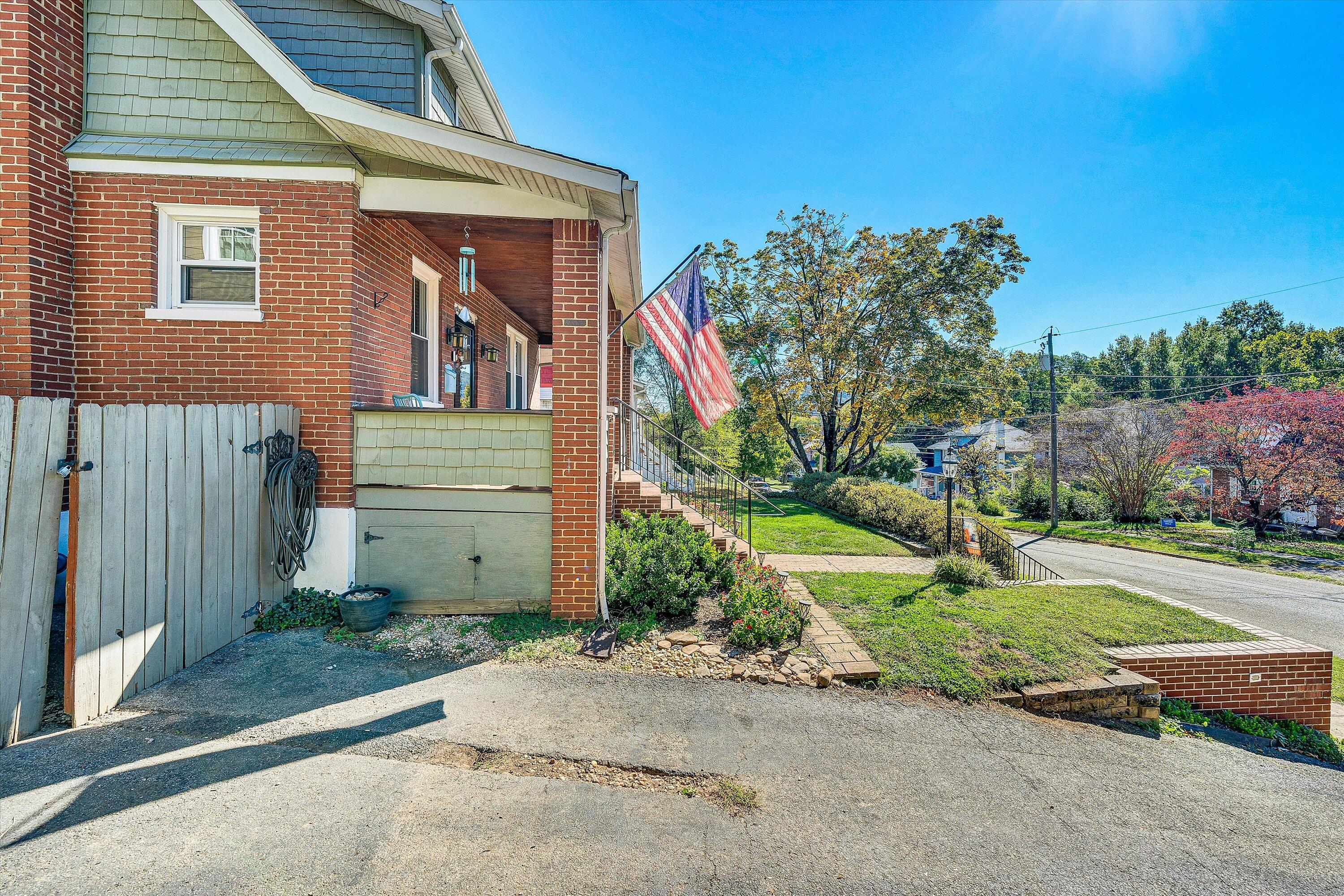 1013 Howbert Avenue Southwest Roanoke, VA 24015 - Photo 5 of 52 a front view of a house with a yard and trees