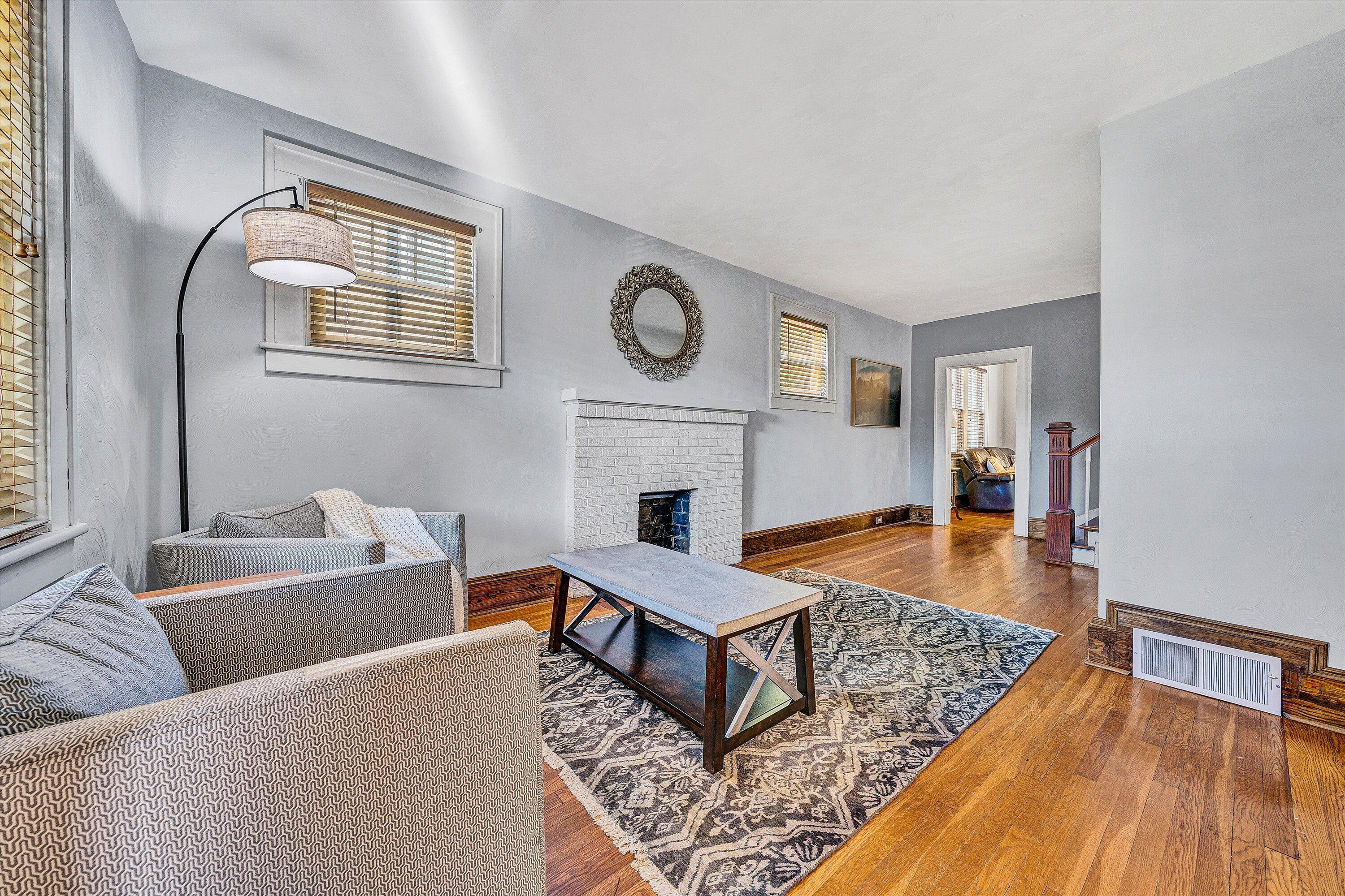 1013 Howbert Avenue Southwest Roanoke, VA 24015 - Photo 6 of 52 a living room with furniture and a fireplace