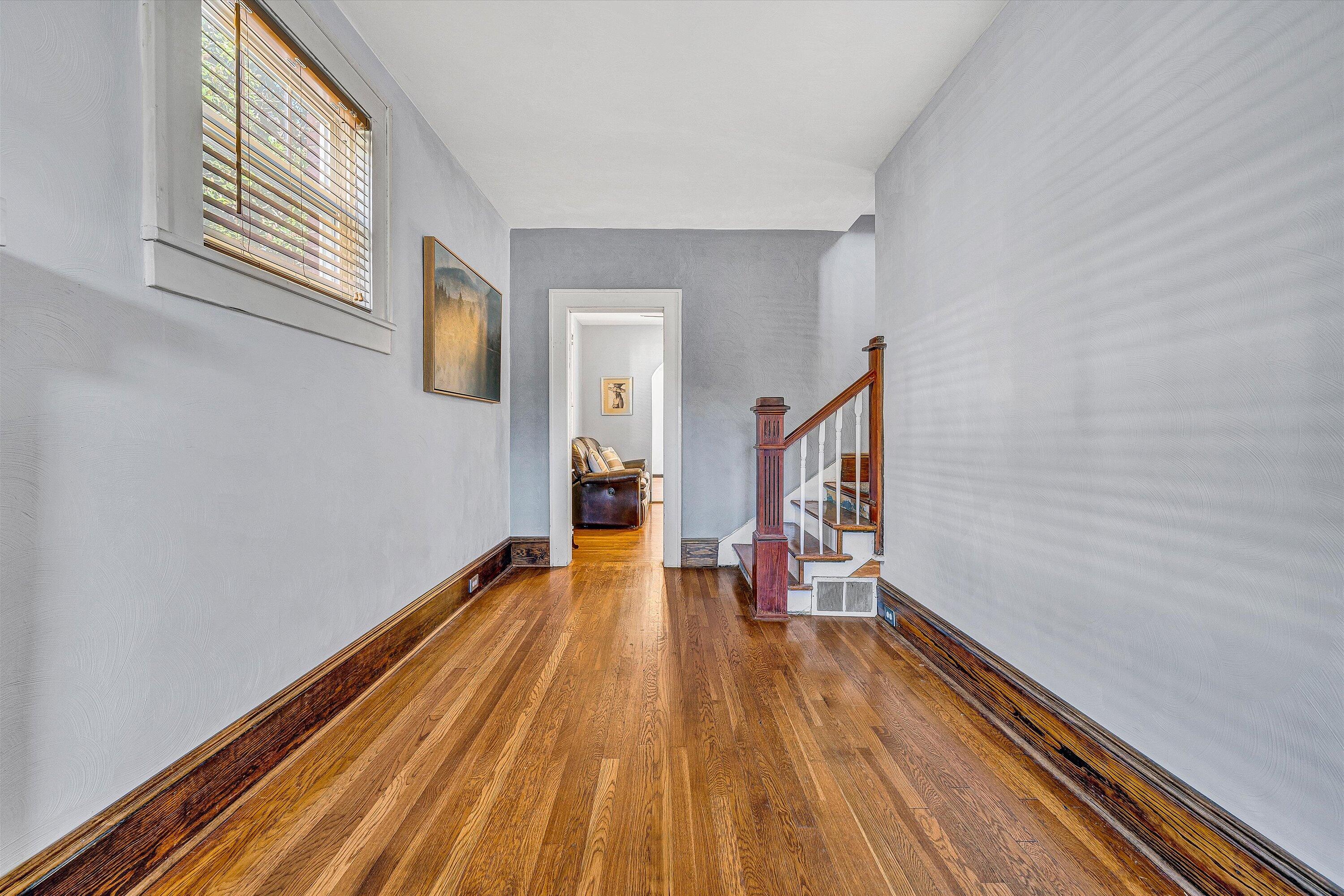 1013 Howbert Avenue Southwest Roanoke, VA 24015 - Photo 8 of 52 a view of a hallway with wooden floor and staircase