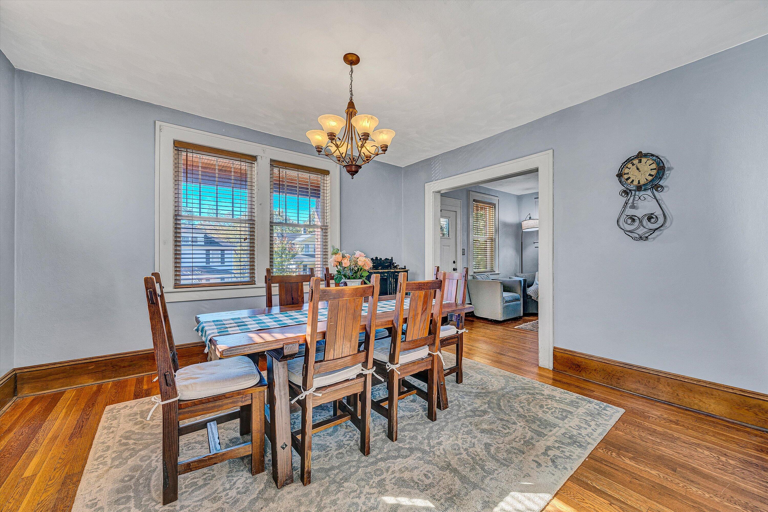 1013 Howbert Avenue Southwest Roanoke, VA 24015 - Photo 10 of 52 a view of a dining room with furniture wooden floor and chandelier