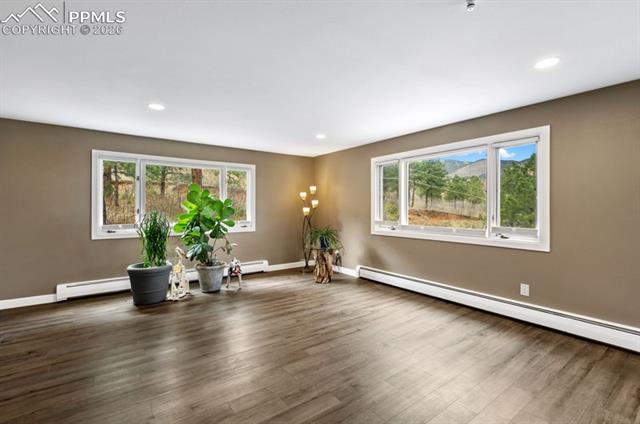 5 Sanford Road Colorado Springs, CO 80906 - Photo 19 of 50 Living room full of windows to let the nature in!