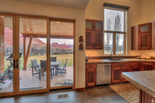 425 Amber Lane Moab, UT 84532 - Photo 7 of 27 Kitchen with glass fronted cabinets and wood finish cabinetry