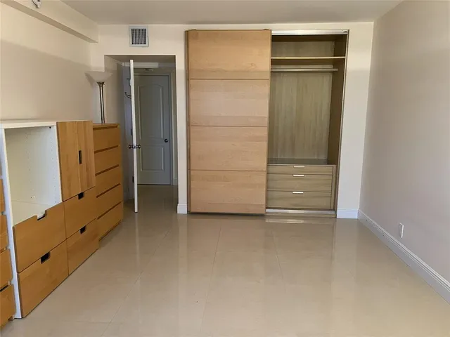 wooden floor and closet in a room
