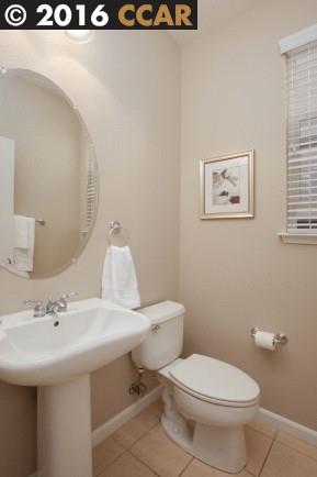 2153 North Donovan Way San Ramon, CA 94582 - Photo 12 of 15 a bathroom with a sink a toilet and mirror
