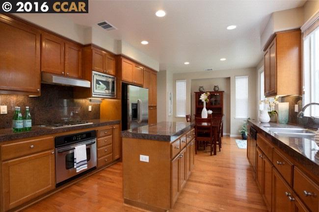 2153 North Donovan Way San Ramon, CA 94582 - Photo 6 of 15 a kitchen with stainless steel appliances granite countertop a stove and a sink