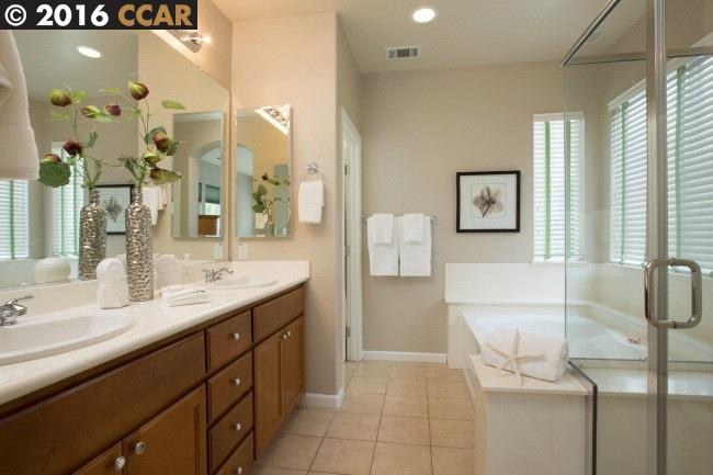 2153 North Donovan Way San Ramon, CA 94582 - Photo 9 of 15 a bathroom with a sink a mirror and a shower
