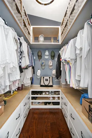 a spacious bathroom with a double vanity sink a and mirror