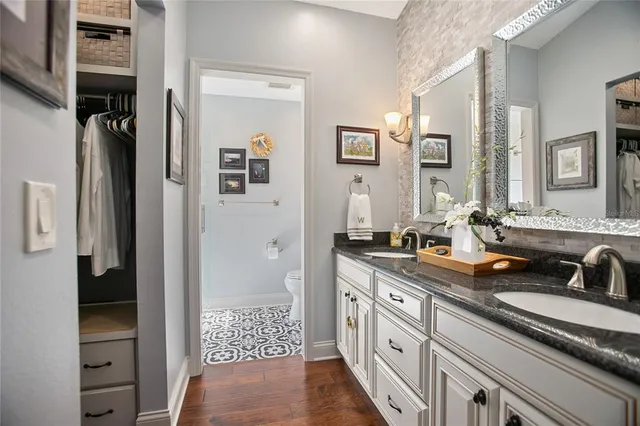 a bathroom with a shower and a sink