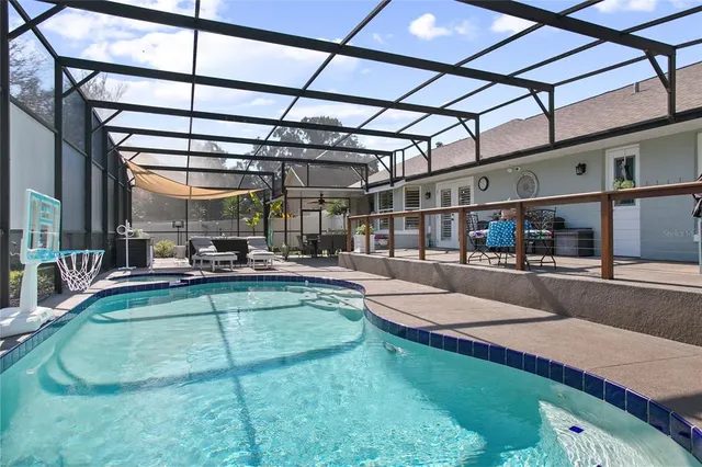 a view of a swimming pool with a patio