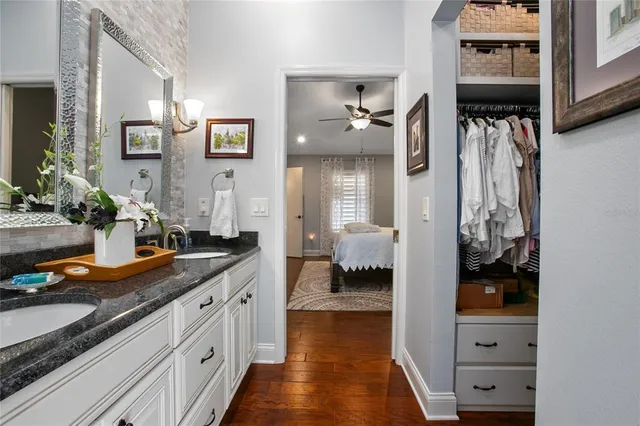 a bedroom with a bed and flat screen tv