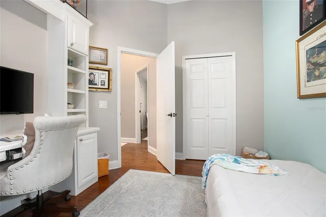 a bedroom with a workspace