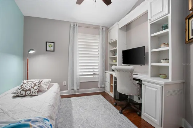 a bedroom with a bed and a couch