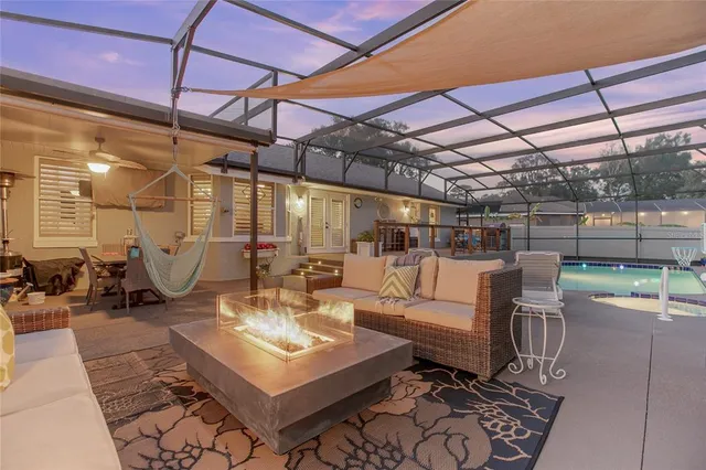 a front view of a house with outdoor seating