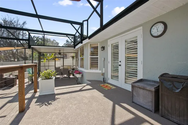 a view of a swimming pool with a patio